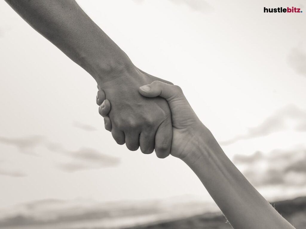 Close-up of two hands clasped together.